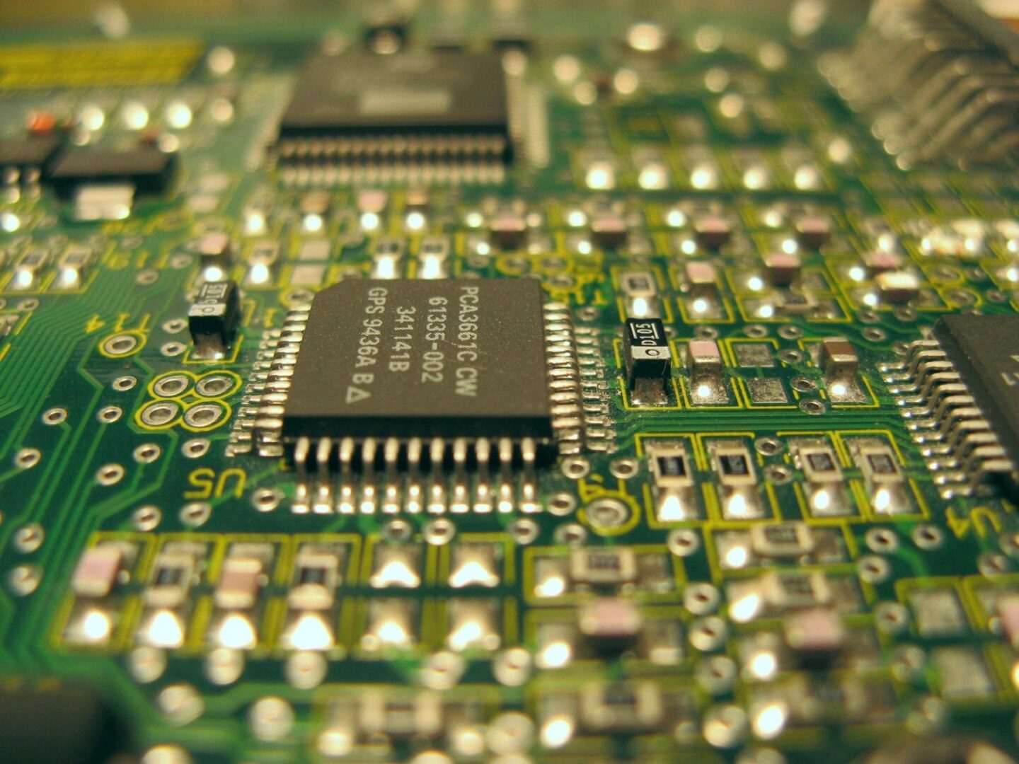 A close up of the electronics on a computer board.