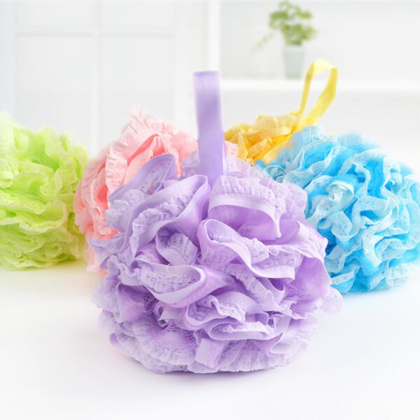 A set of Mesh Bath Ball Shower Sponges on a table.