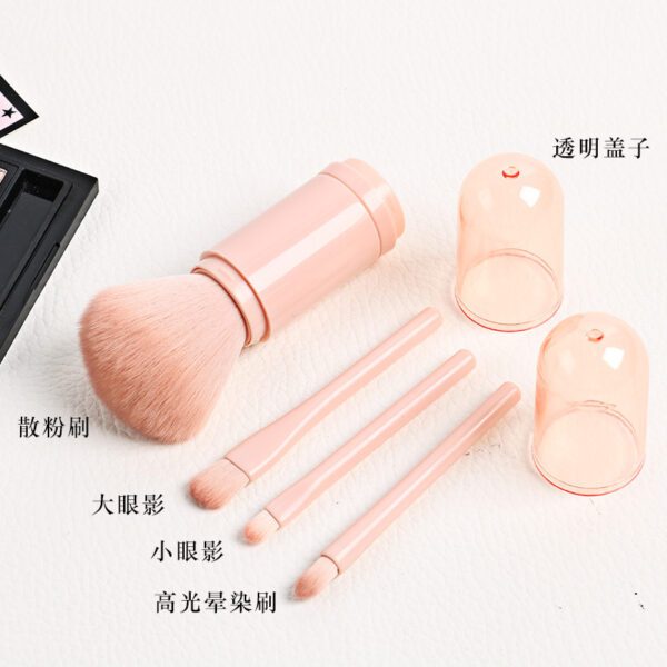 A pink Small Makeup Brush Set with brushes and a mirror.