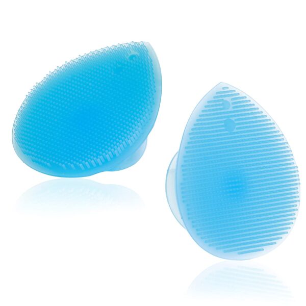 Two silicone cleaning face scrubber brushes on a white surface.