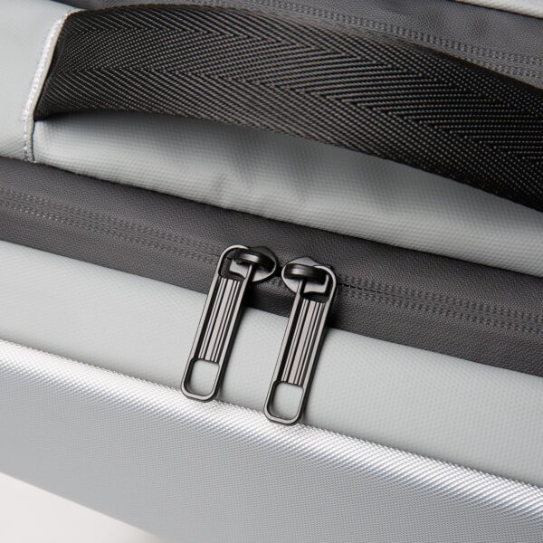 A close up of a Silver Hard Case Backpack with Unique Edge Design - 16.53" x 11.81" x 5.51 with black straps.